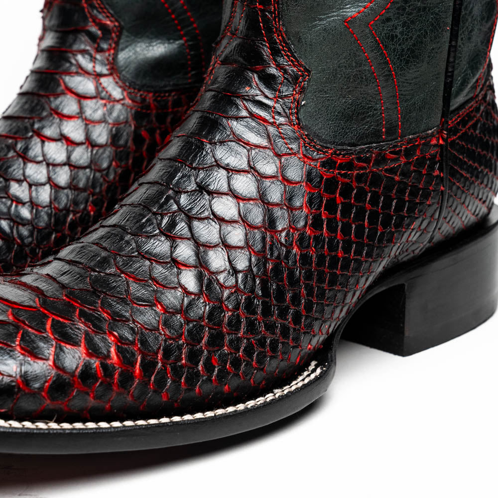 The Missouri BlackCherry by Marco Di Milano are handcrafted men's cowboy boots in black and red with a striking snakeskin texture, decorative stitching, and the sole stamped "Marco Di Milano." One boot is shown upright; the other displays the sole.
