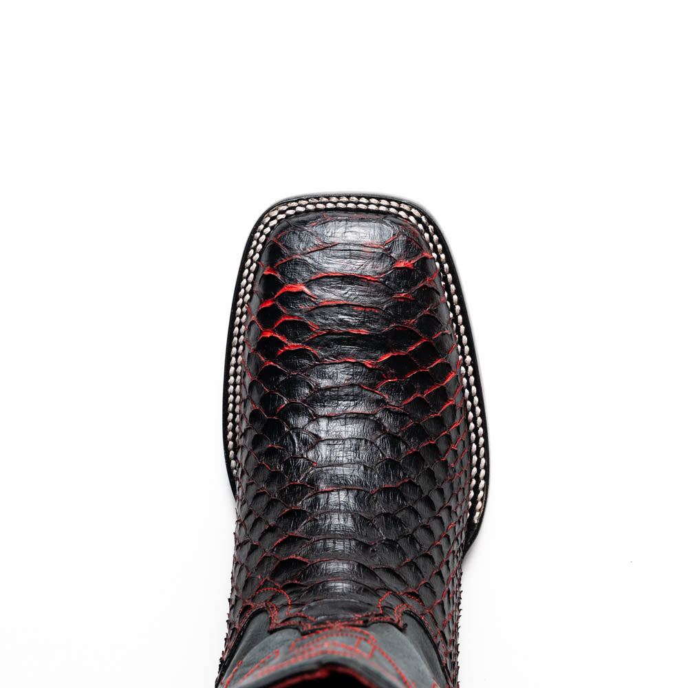 The Missouri BlackCherry by Marco Di Milano are handcrafted men's cowboy boots in black and red with a striking snakeskin texture, decorative stitching, and the sole stamped "Marco Di Milano." One boot is shown upright; the other displays the sole.