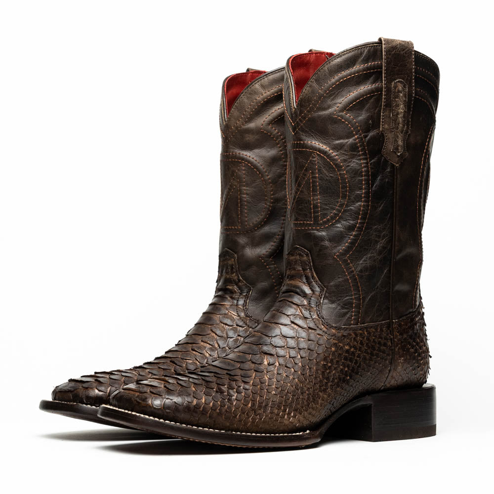Missouri Brown by Marco Di Milano: a pair of handcrafted men's cowboy boots in genuine brown python skin, one standing upright and one displaying the branded sole, for an exotic western look.