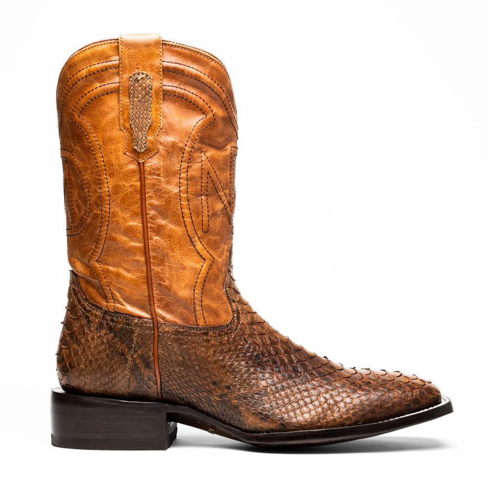 The Missouri Cognac boots by Marco Di Milano showcase classic style and premium detail with brown handcrafted leather, a textured snakeskin pattern, and distinctive branding on the sole.