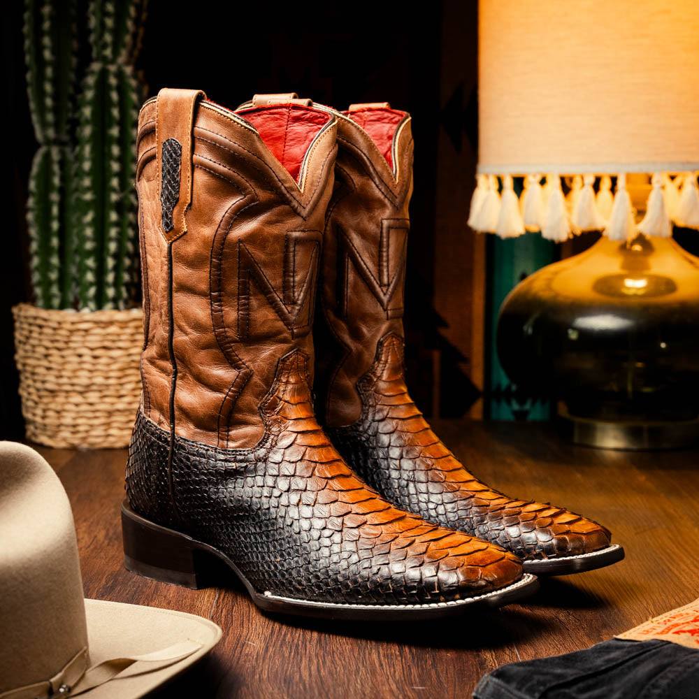 The Missouri Lisboa by Marco Di Milano offers men's cowboy boots with a textured snakeskin-style lower section, smooth upper, and a branded sole for a unique, handcrafted look.