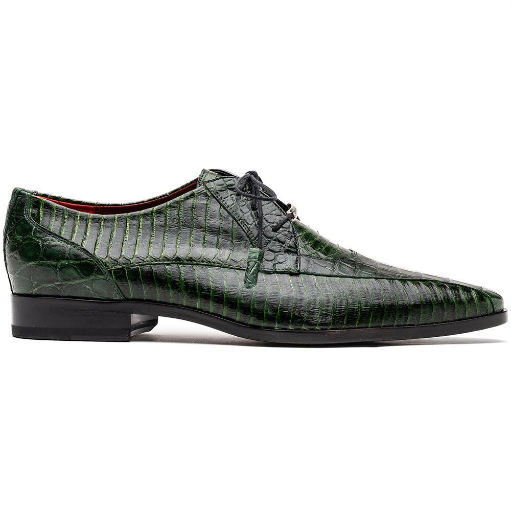 A pair of Moncalieri Green luxury shoes by Marco Di Milano, one upright with tied laces and the other on its side showing the sole—crocodile-patterned elegance at its finest.