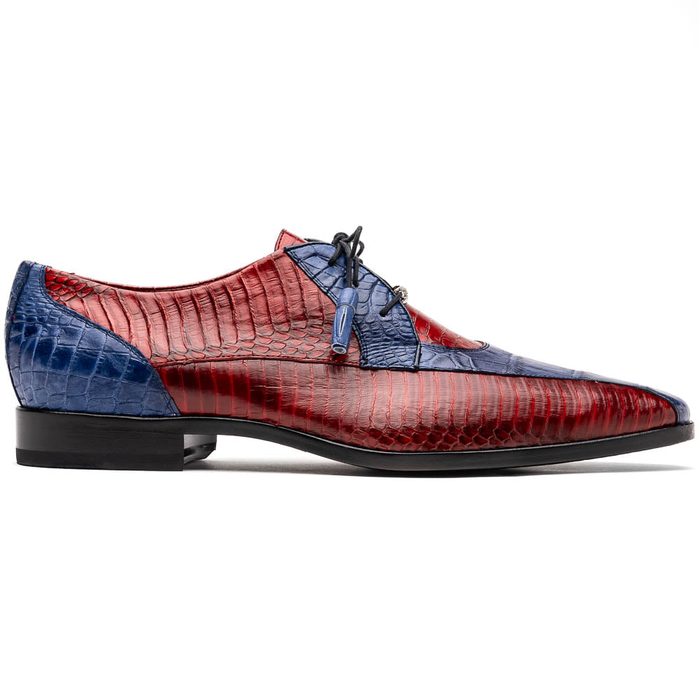 The Moncalieri Navy / Red by Marco Di Milano is a pair of men’s luxury shoes crafted from shiny red and blue crocodile leather with pointed toes, lace-up fronts, hand-painted finishes, and black soles.