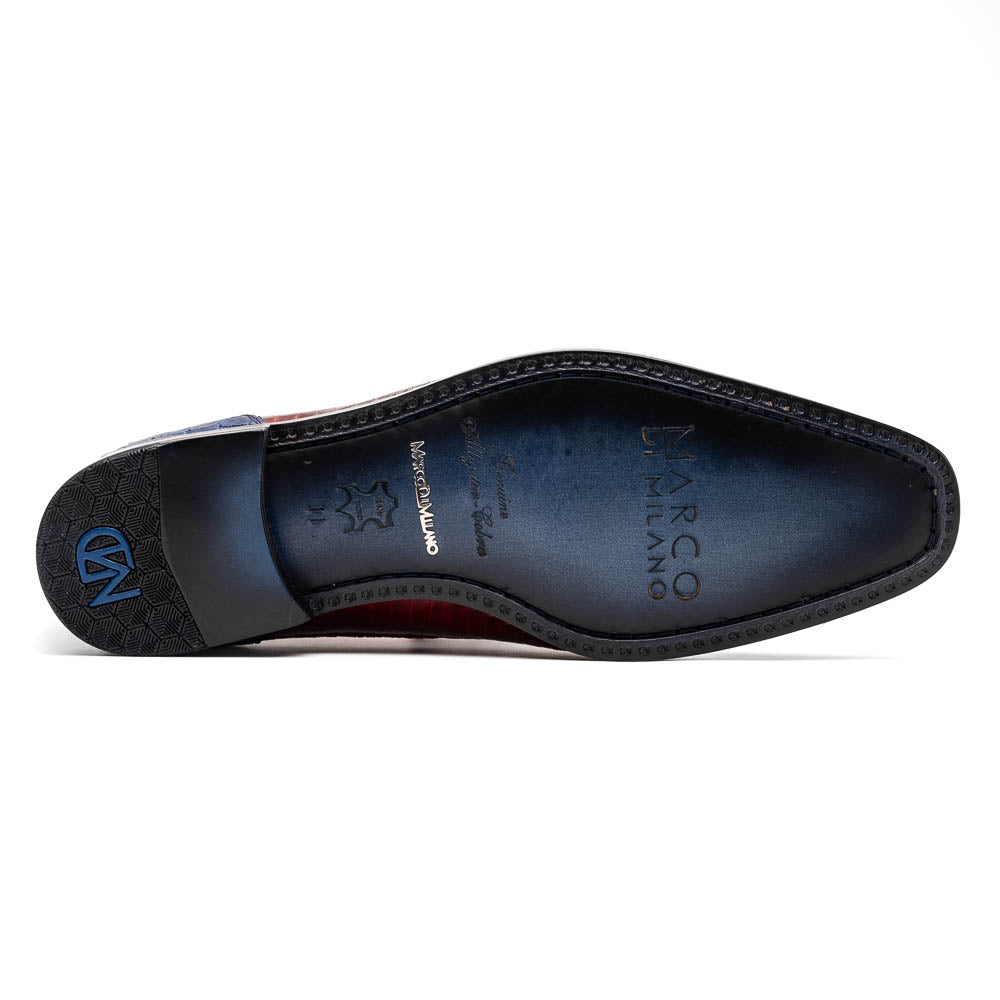 The Moncalieri Navy / Red by Marco Di Milano is a pair of men’s luxury shoes crafted from shiny red and blue crocodile leather with pointed toes, lace-up fronts, hand-painted finishes, and black soles.