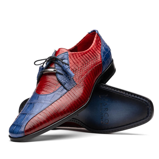 The Moncalieri Navy / Red by Marco Di Milano is a pair of men’s luxury shoes crafted from shiny red and blue crocodile leather with pointed toes, lace-up fronts, hand-painted finishes, and black soles.