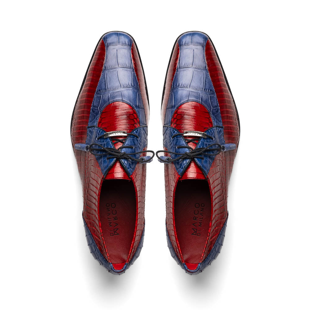 The Moncalieri Navy / Red by Marco Di Milano is a pair of men’s luxury shoes crafted from shiny red and blue crocodile leather with pointed toes, lace-up fronts, hand-painted finishes, and black soles.