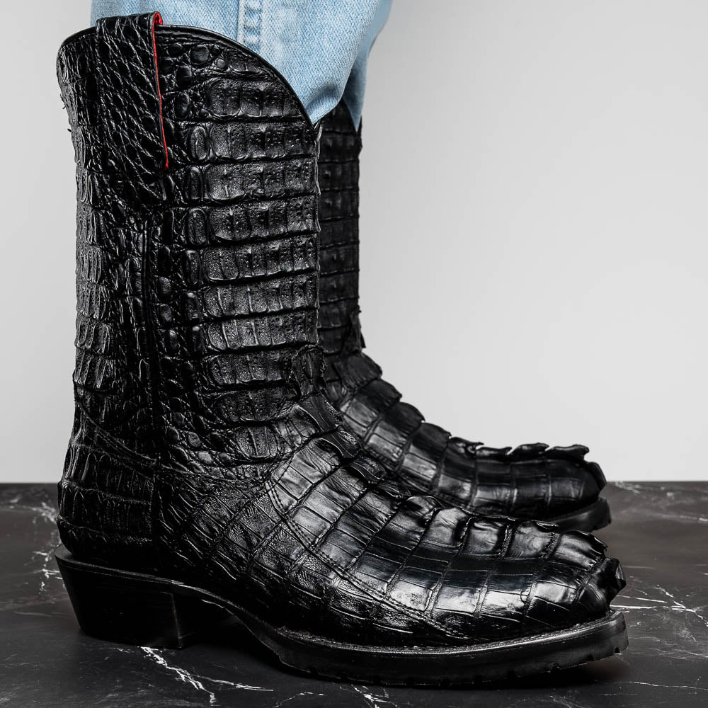 The Marlboro Black by Marco Di Milano: black hornback caiman cowboy boots with a crocodile skin pattern and low heels, shown on a white background.