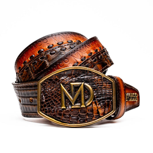 The Montana Belt Aged Brown by Marco Di Milano features aged brown leather with embossed patterns, metal studs, a bold gold MD monogram buckle, and the brand name on the strap for a sophisticated Western look.