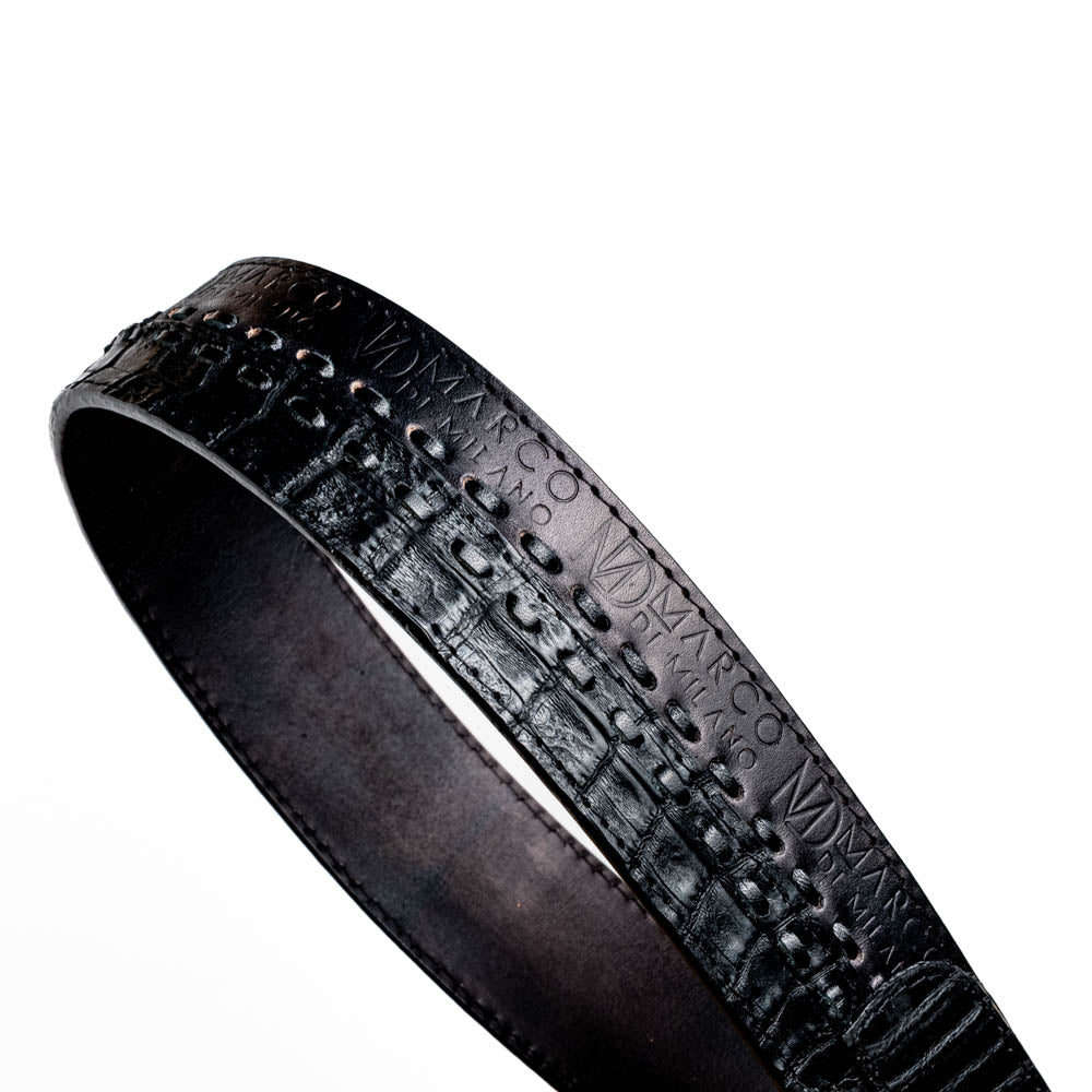 The Marco Di Milano Montana Belt Black features handcrafted black textured leather and a large gold MD monogram buckle, elegantly coiled against a white background.