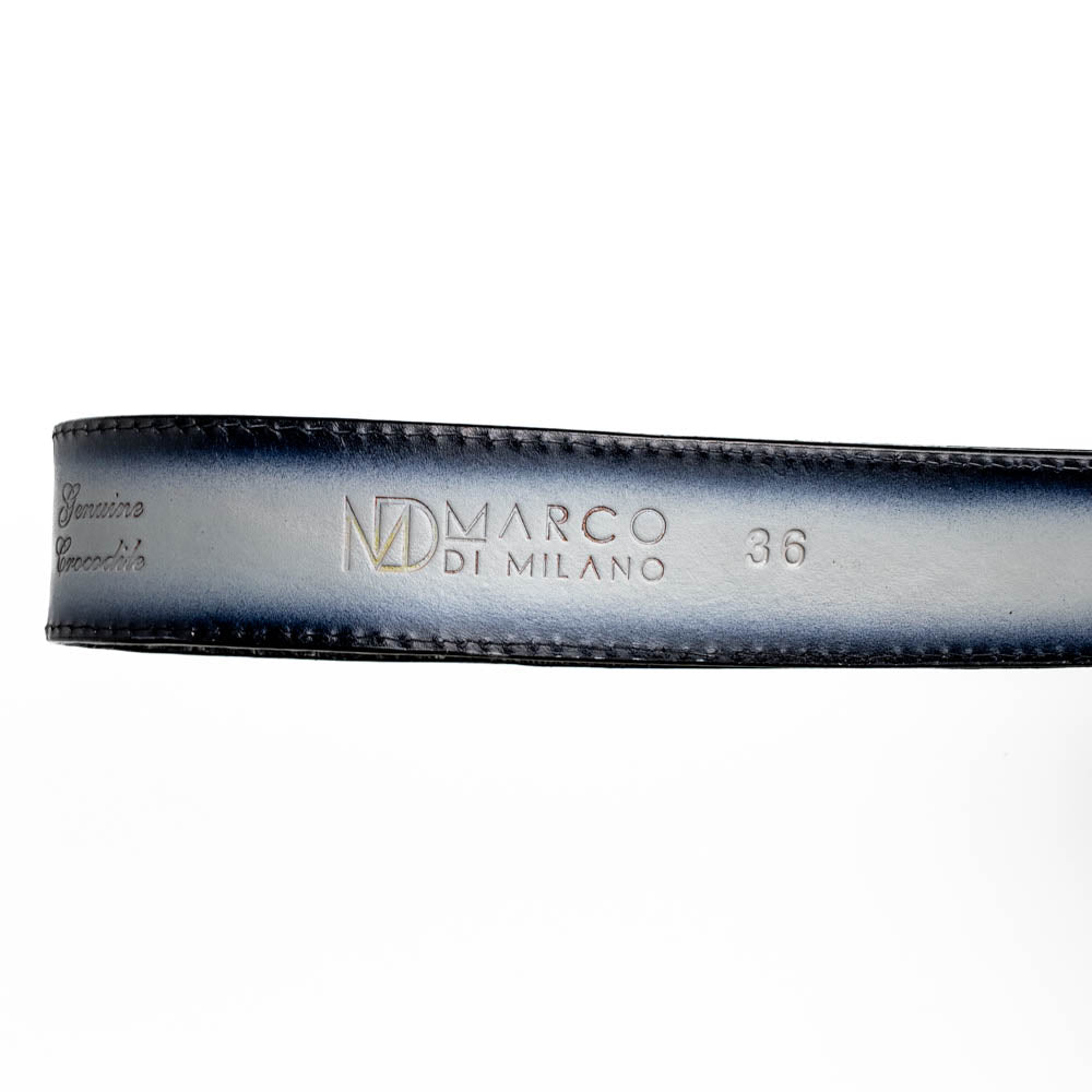 The Montana Belt Stone Gray by Marco Di Milano is a handcrafted leather belt, featuring a gold MD logo buckle and embossed branding on the caiman crocodile strap.