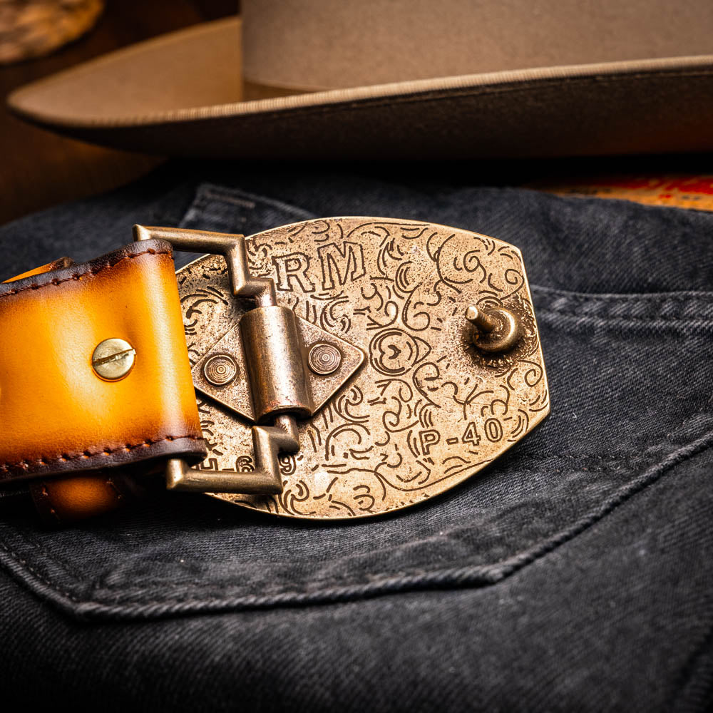The Montana Belt Mustard Brown by Marco Di Milano features a brown caiman crocodile texture, a bold gold "MD" buckle, and "MARCO DI MILANO" embossed on the side, reflecting the brand’s renowned craftsmanship.