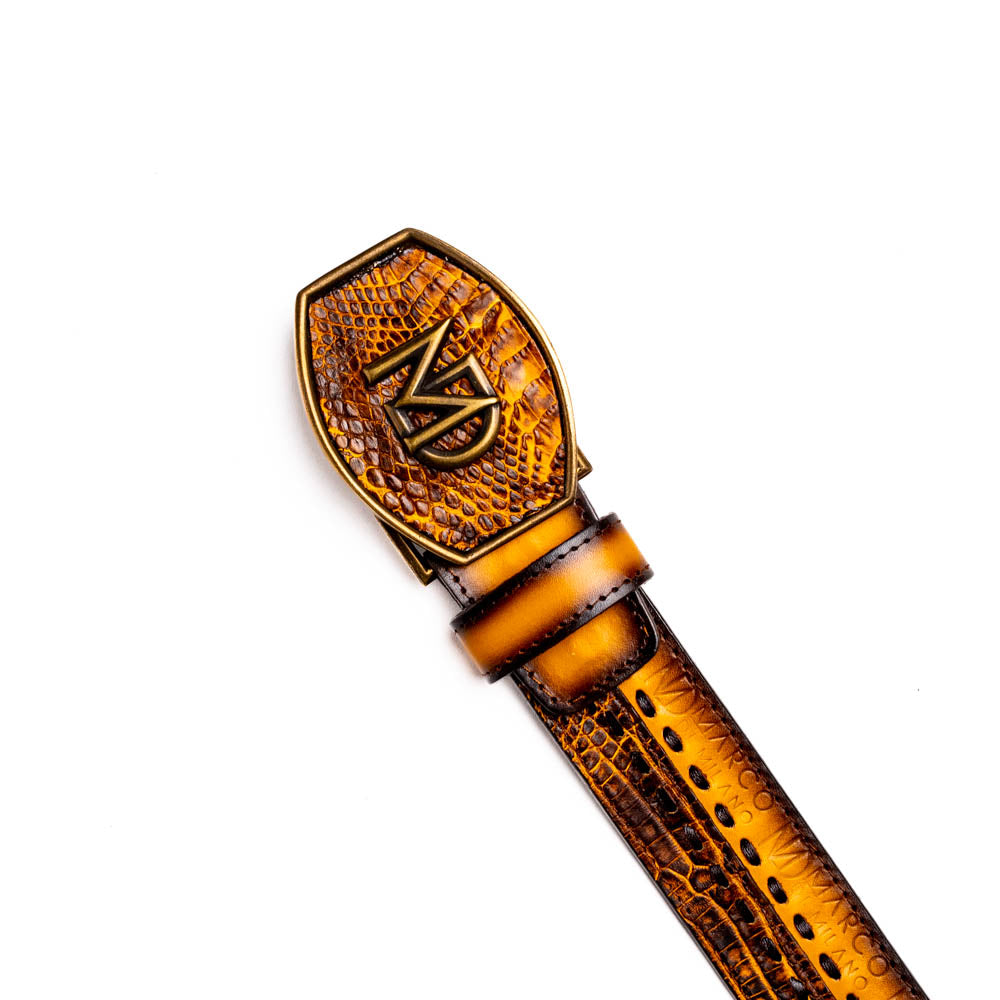 The Montana Belt Mustard Brown by Marco Di Milano features a brown caiman crocodile texture, a bold gold "MD" buckle, and "MARCO DI MILANO" embossed on the side, reflecting the brand’s renowned craftsmanship.