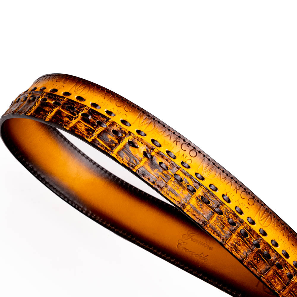 The Montana Belt Mustard Brown by Marco Di Milano features a brown caiman crocodile texture, a bold gold "MD" buckle, and "MARCO DI MILANO" embossed on the side, reflecting the brand’s renowned craftsmanship.