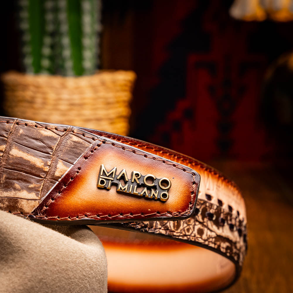 The Montana Belt Stone Brown by Marco Di Milano is a handcrafted western leather belt with a caiman crocodile pattern and a bold gold "MD" buckle.