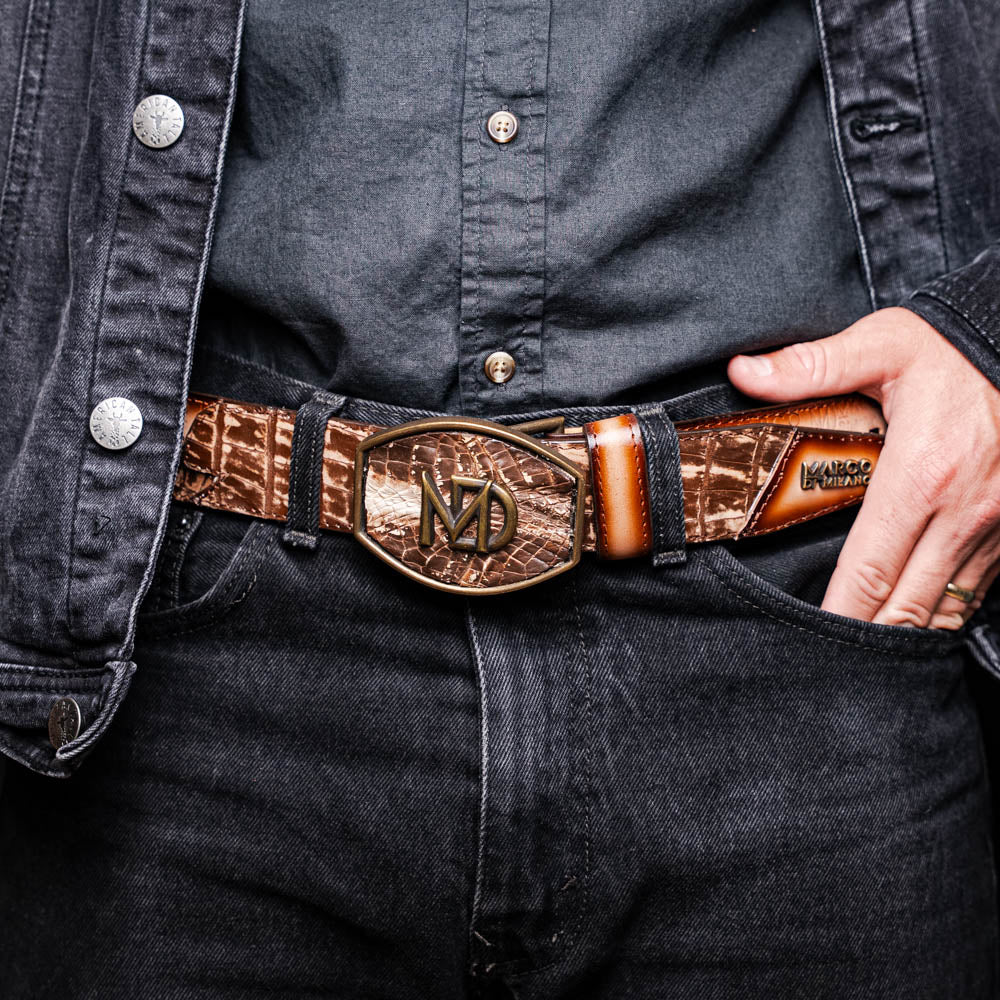 The Montana Belt Stone Brown by Marco Di Milano is a handcrafted western leather belt with a caiman crocodile pattern and a bold gold "MD" buckle.