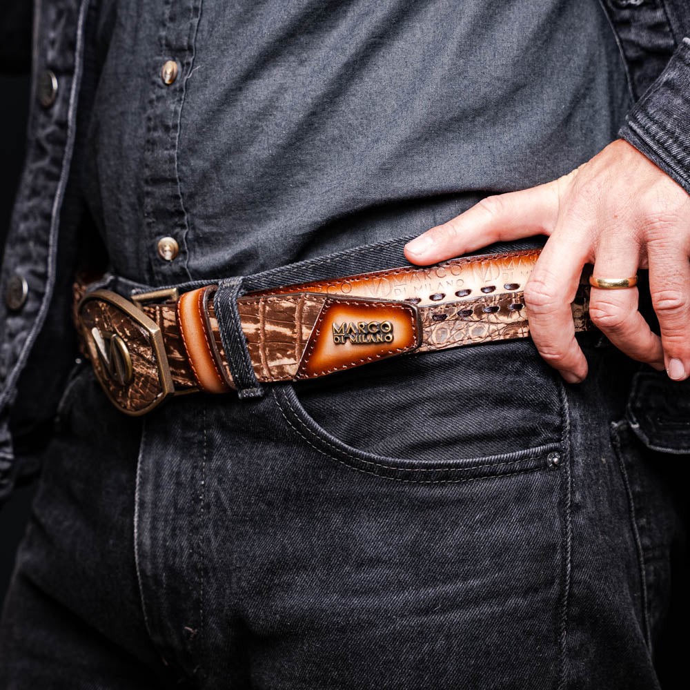 The Montana Belt Stone Brown by Marco Di Milano is a handcrafted western leather belt with a caiman crocodile pattern and a bold gold "MD" buckle.