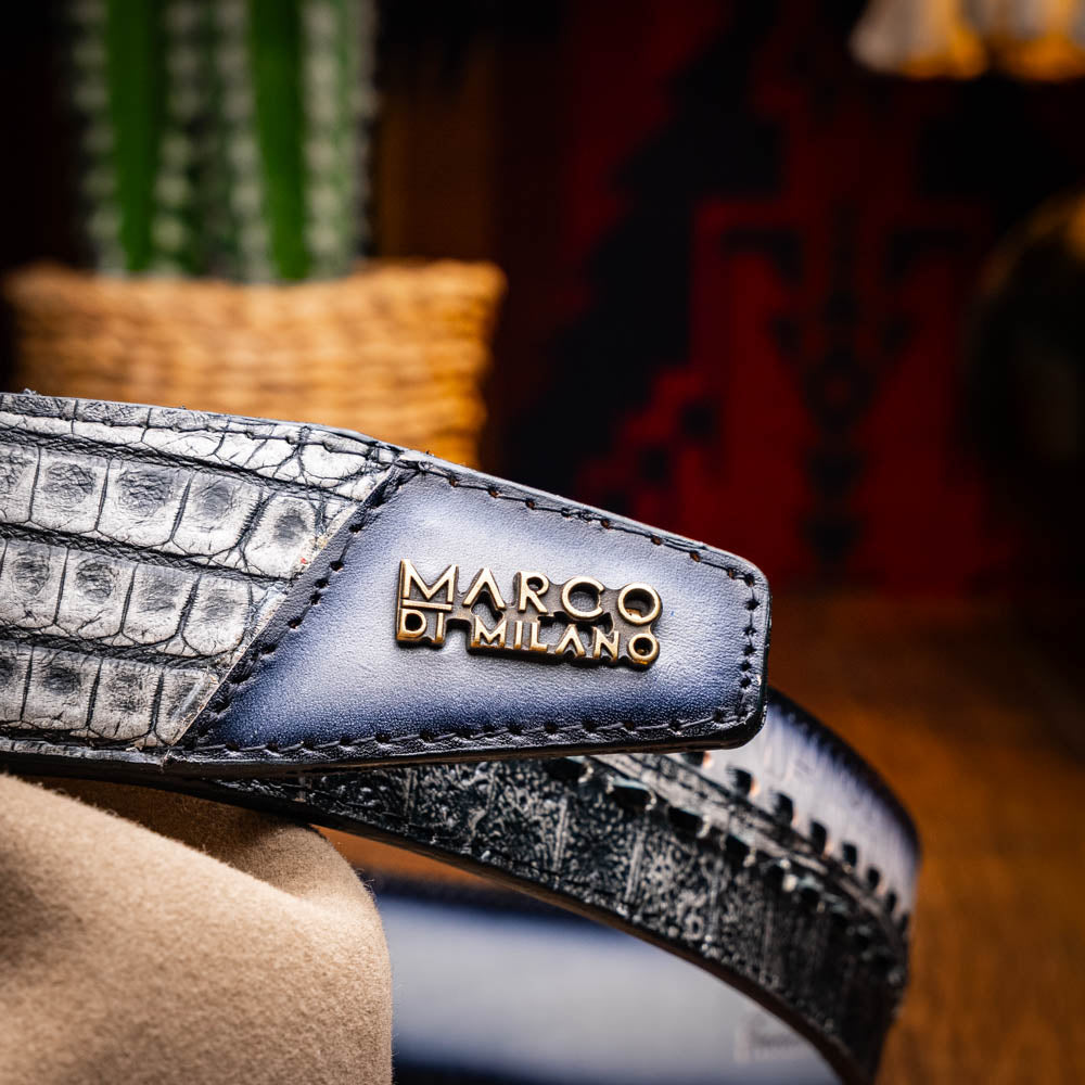 The Montana Belt Stone Gray by Marco Di Milano is a handcrafted leather belt, featuring a gold MD logo buckle and embossed branding on the caiman crocodile strap.