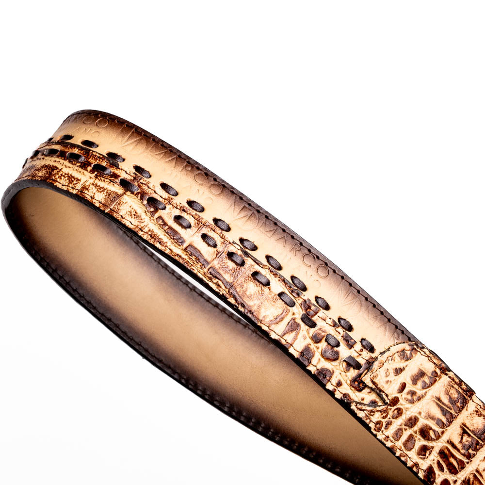 The Montana Belt Stone Orix by Marco Di Milano is a brown handcrafted leather belt with a caiman crocodile pattern and a bold gold MD monogram buckle, elegantly coiled on a white background.