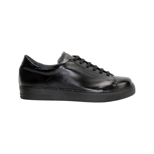 The Duca Monza Black by Duca Di Matiste is a genuine black leather low-top sneaker with black laces and a flat rubber sole, pictured in side profile against a white background—perfect for everyday elegance.