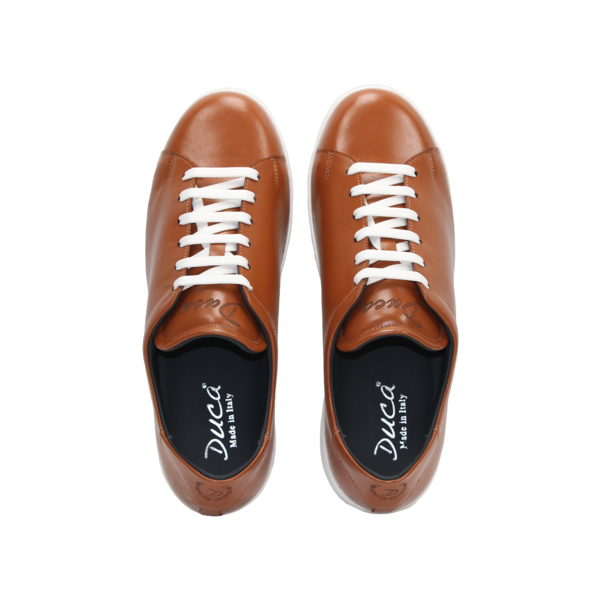 The Duca Monza Ambra by Duca Di Matiste is a brown genuine leather low-top sneaker with white laces and a white rubber sole, displayed in profile on a plain white background—ideal for everyday elegance.
