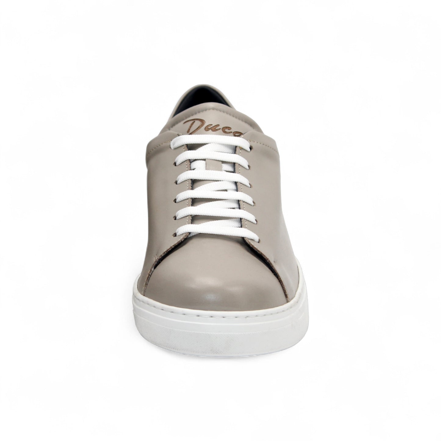 The Duca Di Matiste Duca Monza Grey is a genuine leather low-top sneaker in beige, with white laces and a white sole. Shown from the side on a plain white background, these shoes are perfect for everyday wear.