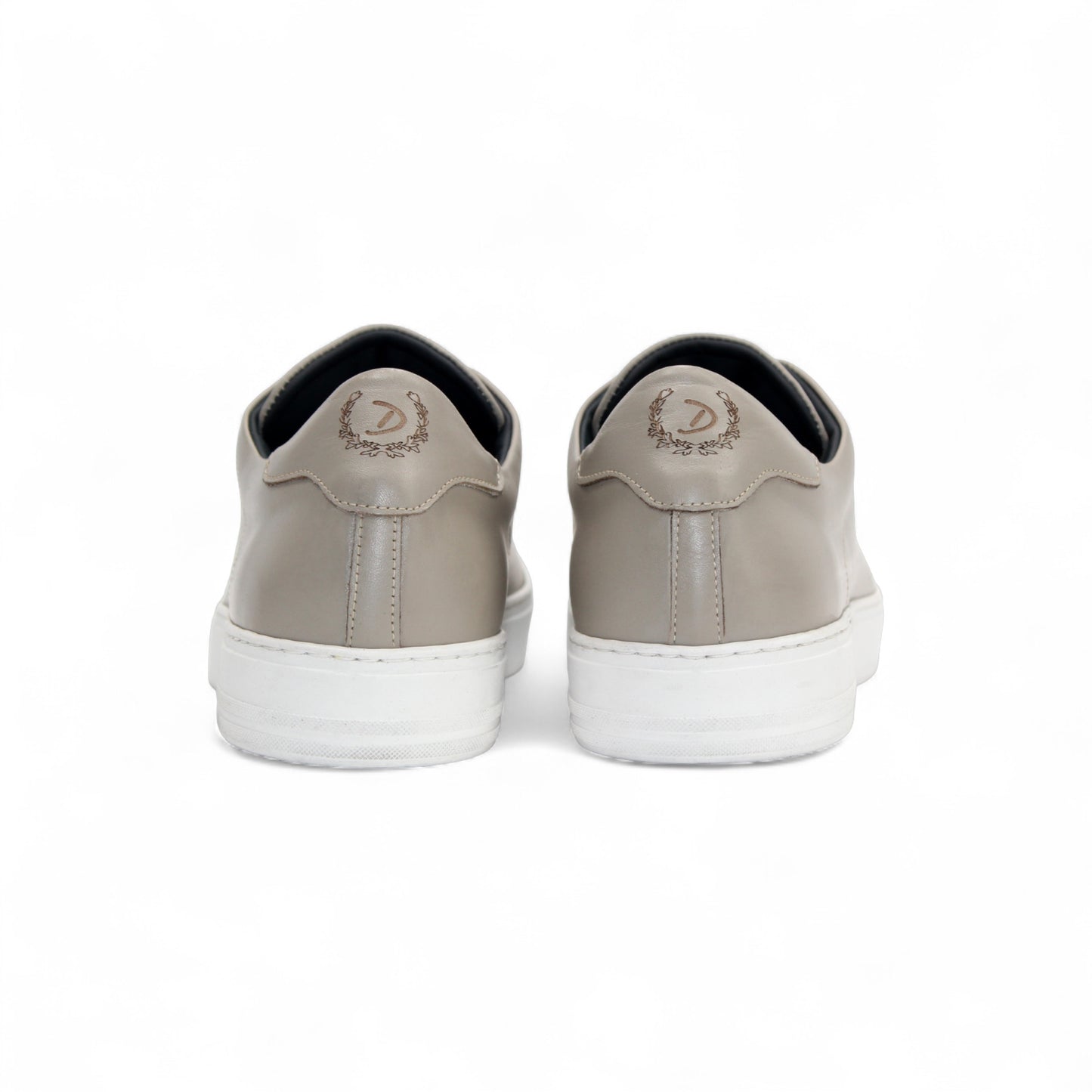 The Duca Di Matiste Duca Monza Grey is a genuine leather low-top sneaker in beige, with white laces and a white sole. Shown from the side on a plain white background, these shoes are perfect for everyday wear.
