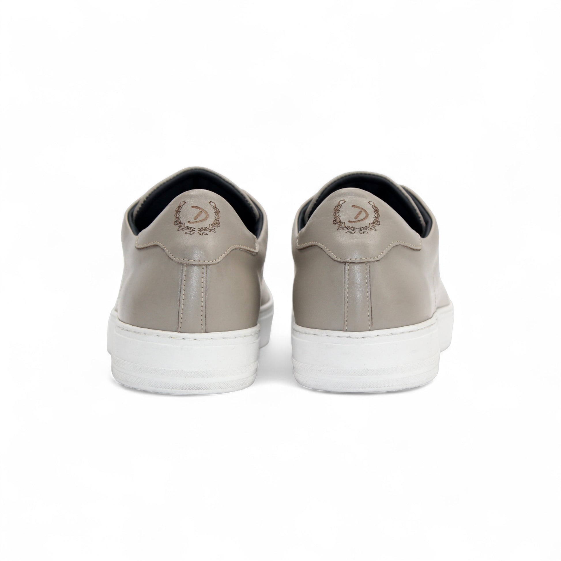 The Duca Di Matiste Duca Monza Grey is a genuine leather low-top sneaker in beige, with white laces and a white sole. Shown from the side on a plain white background, these shoes are perfect for everyday wear.