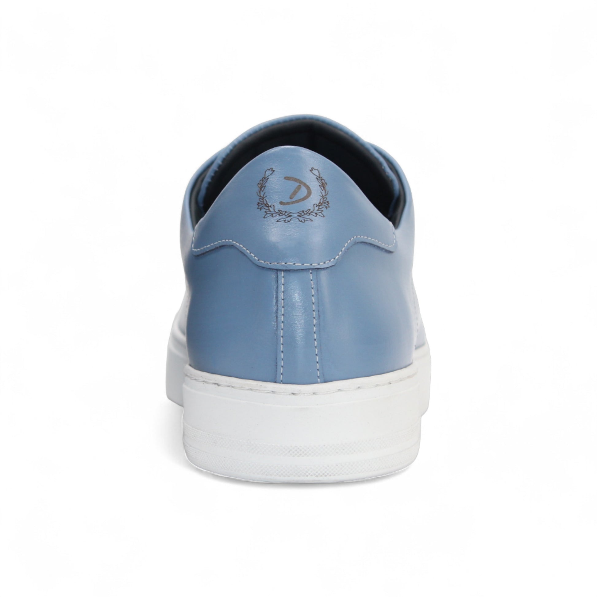 The Duca Monza Light Blue sneaker by Duca Di Matiste features genuine leather in light blue, white laces, and a thick white sole—an effortlessly versatile shoe that highlights Italian craftsmanship, shown in profile on a plain white background.