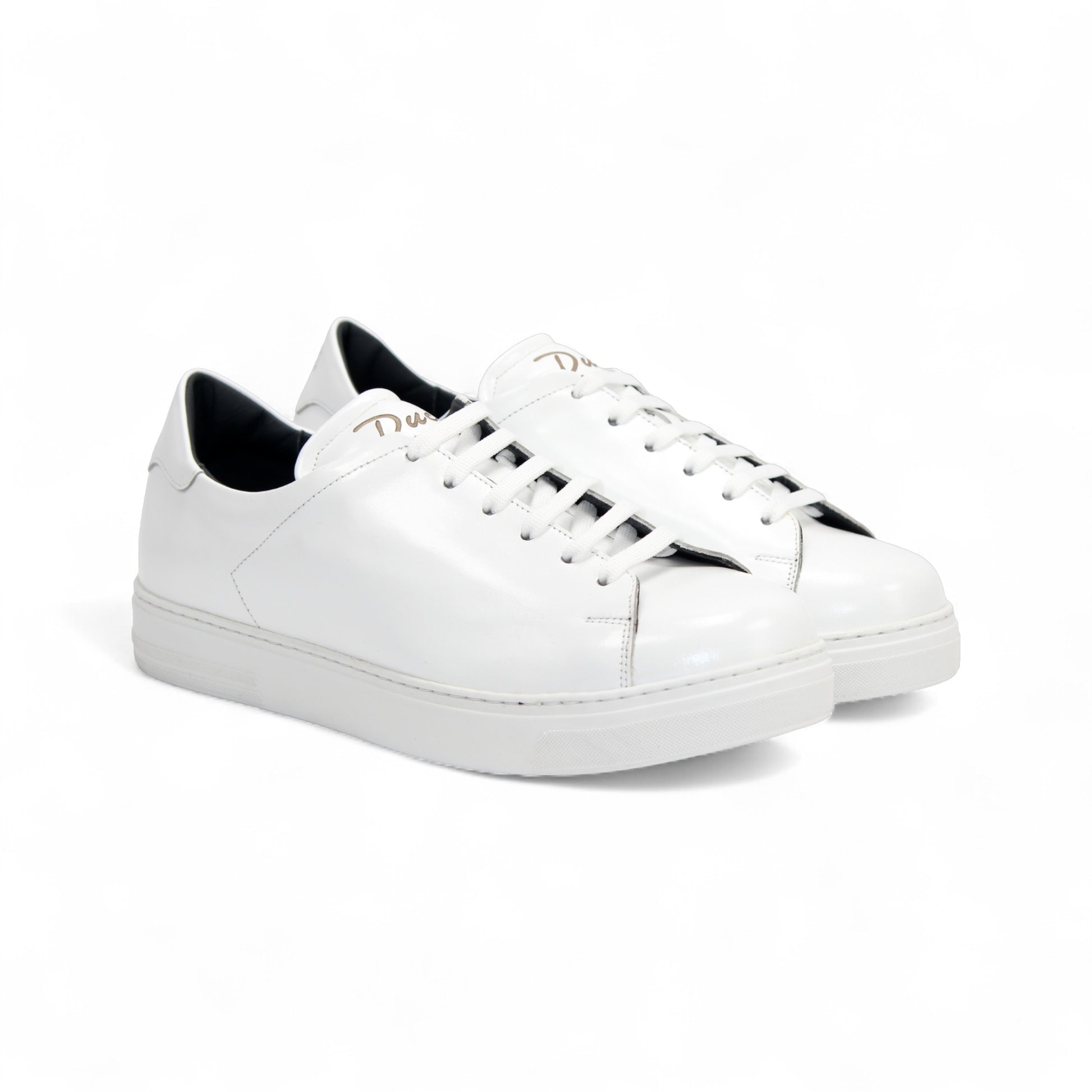 The Duca Monza White by Duca Di Matiste is a genuine leather low-top sneaker with white laces, a flat sole, and minimal detailing. Photographed from the side on a plain background, it embodies effortless everyday elegance.