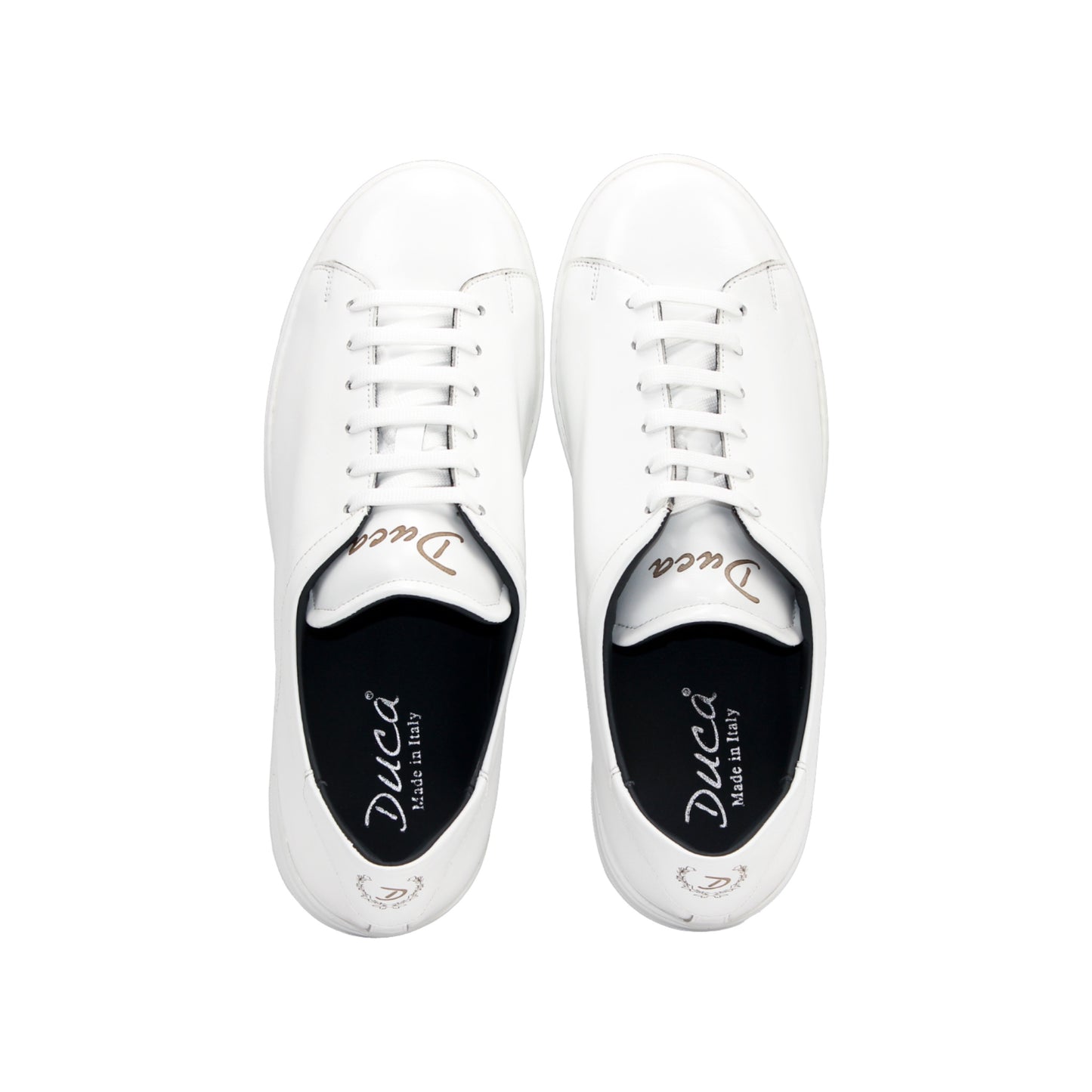 The Duca Monza White by Duca Di Matiste is a genuine leather low-top sneaker with white laces, a flat sole, and minimal detailing. Photographed from the side on a plain background, it embodies effortless everyday elegance.