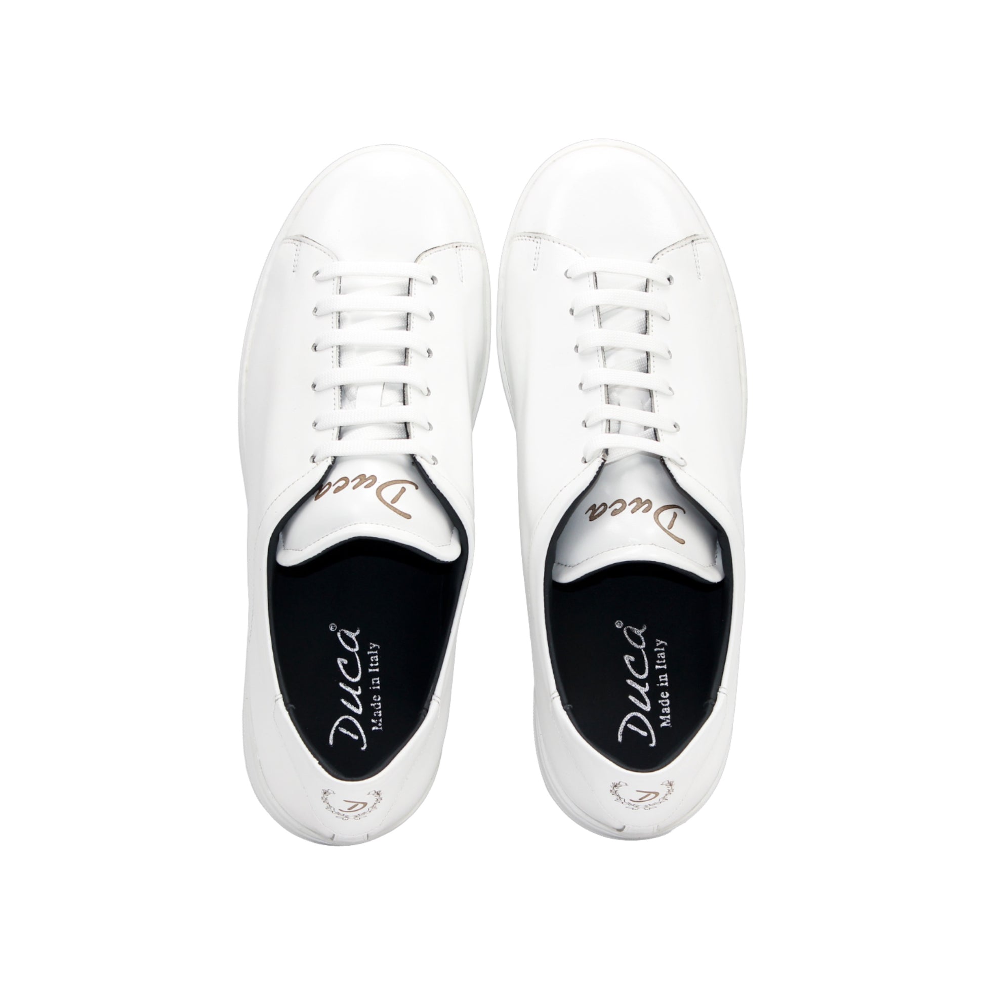The Duca Monza White by Duca Di Matiste is a genuine leather low-top sneaker with white laces, a flat sole, and minimal detailing. Photographed from the side on a plain background, it embodies effortless everyday elegance.
