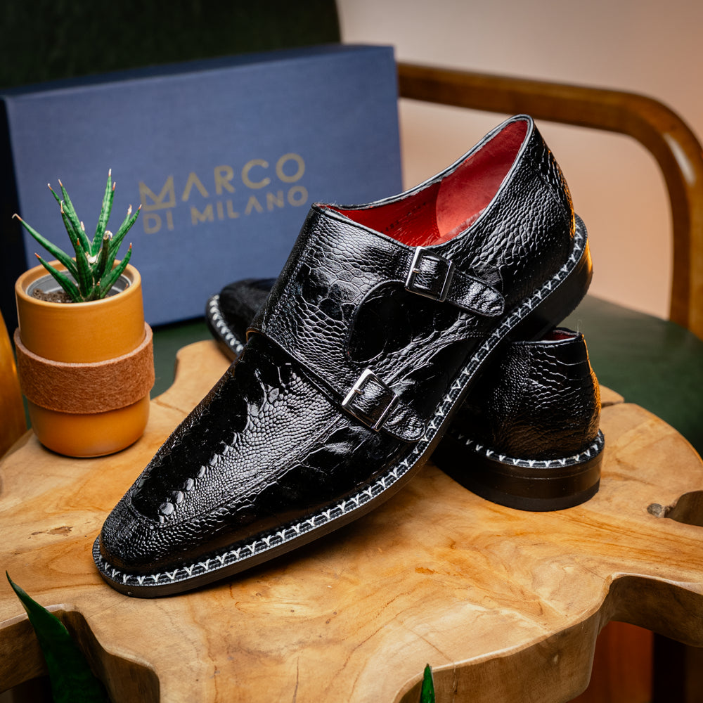 The Marco Di Milano Napoli Black is a pair of genuine ostrich leg dress shoes featuring a textured pattern, double monk strap, and brown branded sole—one shoe upright, the other showing the sole.