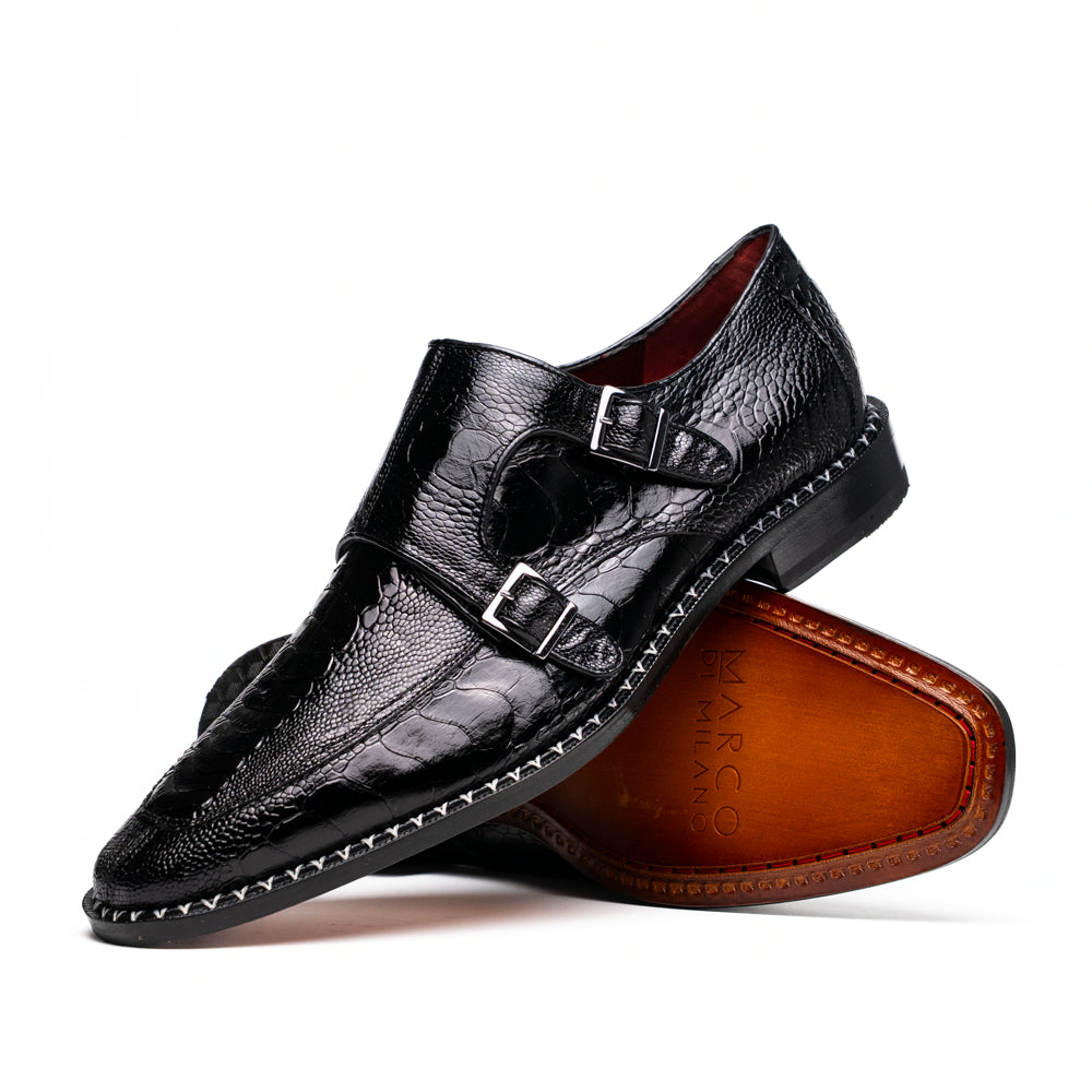 The Marco Di Milano Napoli Black is a pair of genuine ostrich leg dress shoes featuring a textured pattern, double monk strap, and brown branded sole—one shoe upright, the other showing the sole.