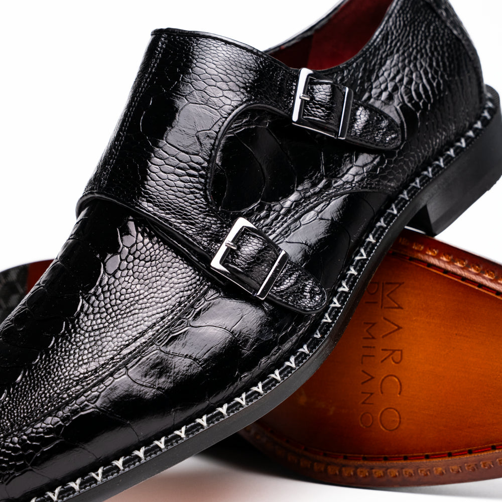 The Marco Di Milano Napoli Black is a pair of genuine ostrich leg dress shoes featuring a textured pattern, double monk strap, and brown branded sole—one shoe upright, the other showing the sole.