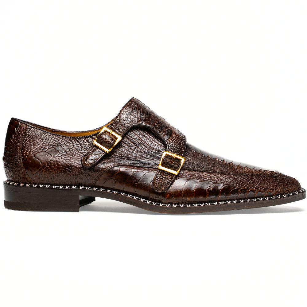 The Marco Di Milano Napoli Brown features brown leather double monk strap dress shoes with a genuine ostrich leg pattern and gold buckles, shown with one shoe upright and the other on its side.