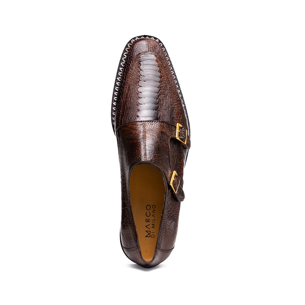 The Marco Di Milano Napoli Brown features brown leather double monk strap dress shoes with a genuine ostrich leg pattern and gold buckles, shown with one shoe upright and the other on its side.