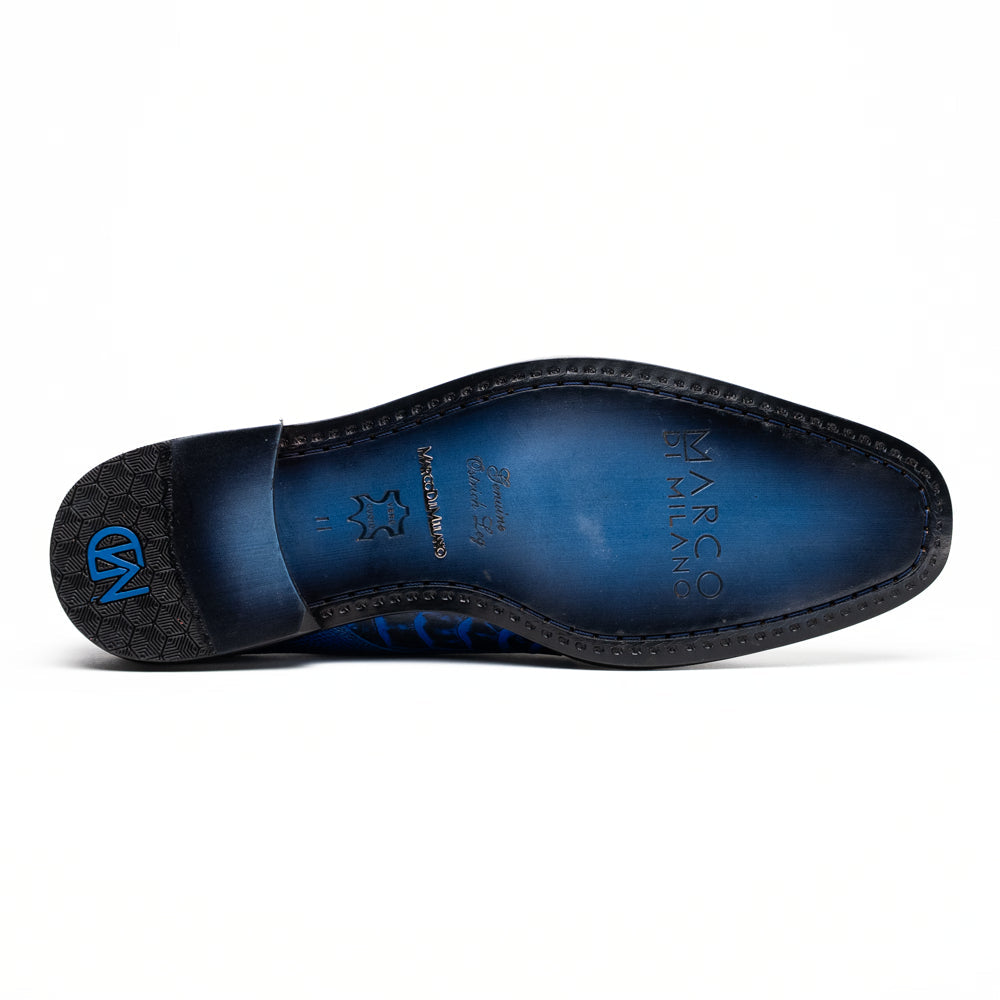 The Marco Di Milano Napoli Electric Blue exotic leather double monk strap shoes are shown: one upright and one on its side displaying the sole, set against a white background.