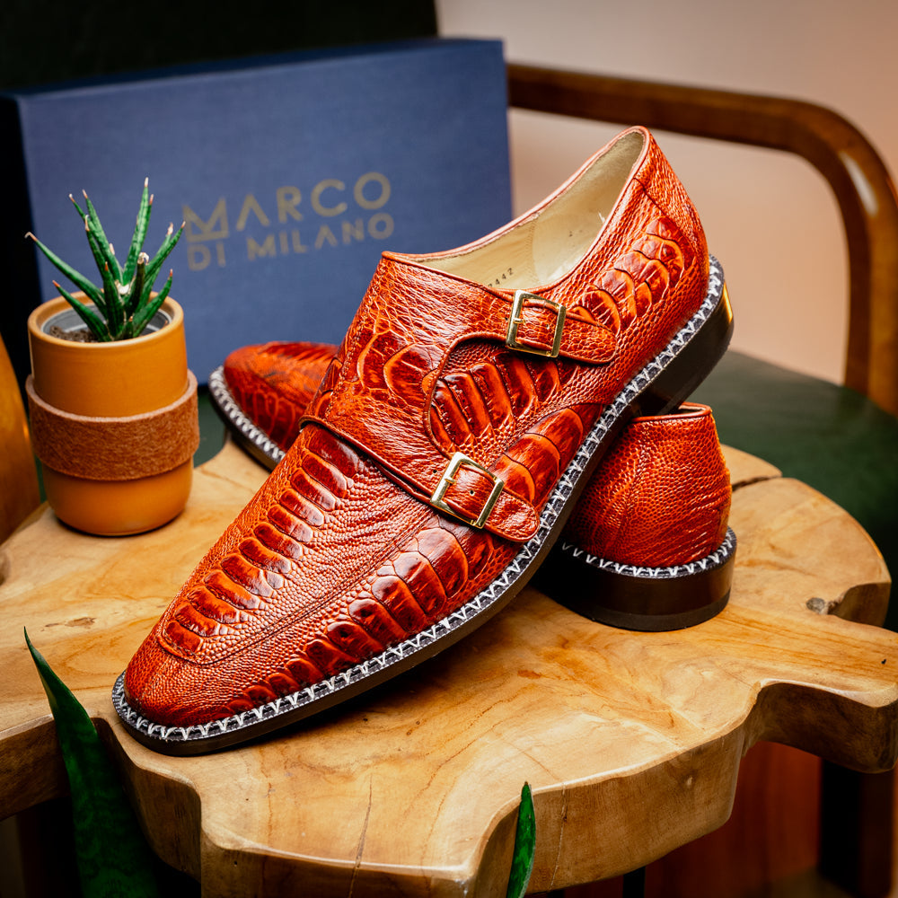 A pair of Marco Di Milano Napoli Rustic Cognac double monk strap dress shoes in genuine ostrich leg leather, with one shoe upright and the other on its side to show the sole.