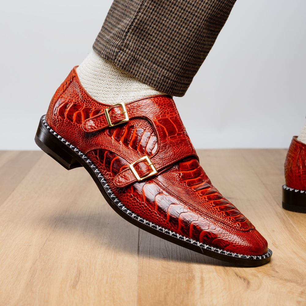 A pair of Marco Di Milano Napoli Rustic Cognac double monk strap dress shoes in genuine ostrich leg leather, with one shoe upright and the other on its side to show the sole.