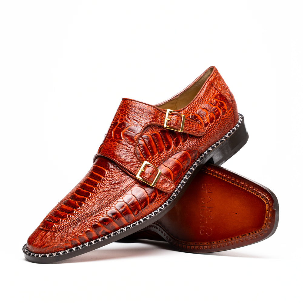 A pair of Marco Di Milano Napoli Rustic Cognac double monk strap dress shoes in genuine ostrich leg leather, with one shoe upright and the other on its side to show the sole.