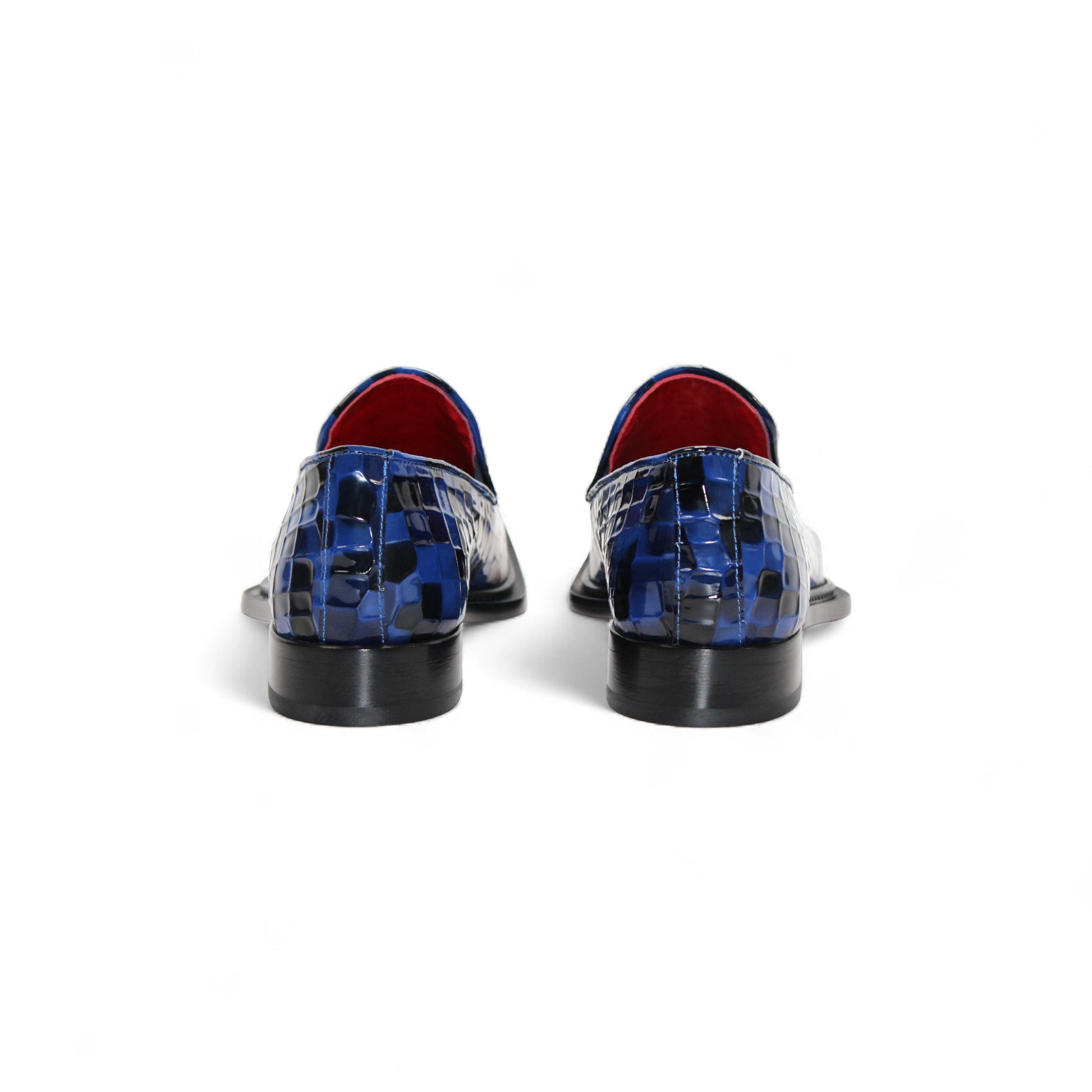 The Emilio Franco Couture Narciso Navy Combo loafer features blue and black checkered Italian patent leather, a silver buckle, and red interior trim—striking designer footwear from Emilio Franco Couture, shown in side profile on a white background.