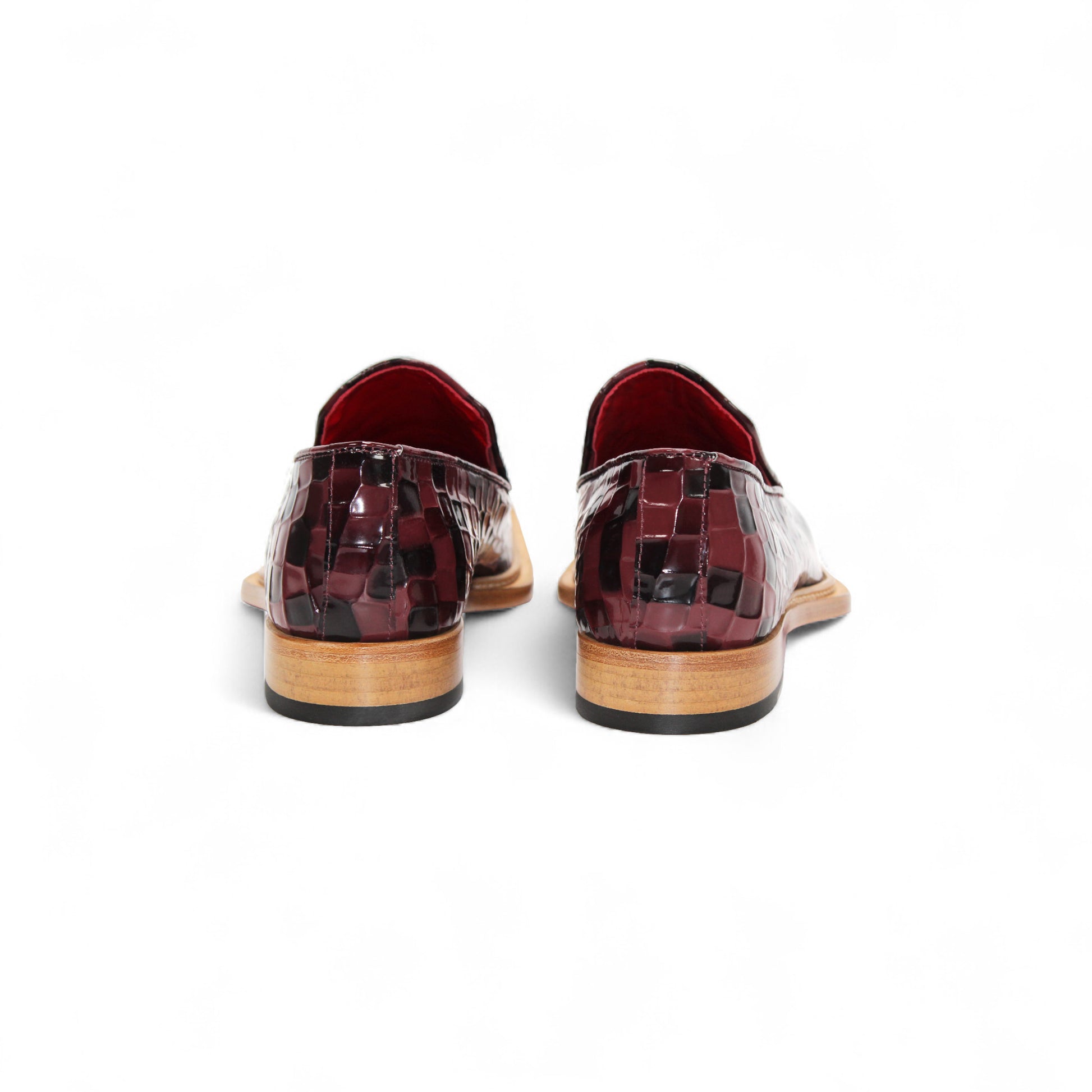 The Emilio Franco Couture Narciso Burgundy Combo loafer features a burgundy and black checkered leather design, Italian patent style, metal detail on the upper, low wooden heel, and bold red interior lining.