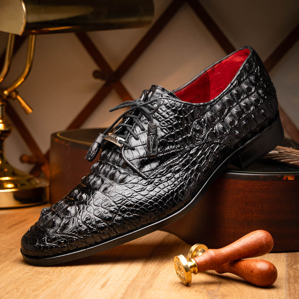The Nilo Black by Marco Di Milano is a pair of luxury men's shoes made from polished black Nile crocodile skin with red inner lining and brown leather soles embossed with the brand name.
