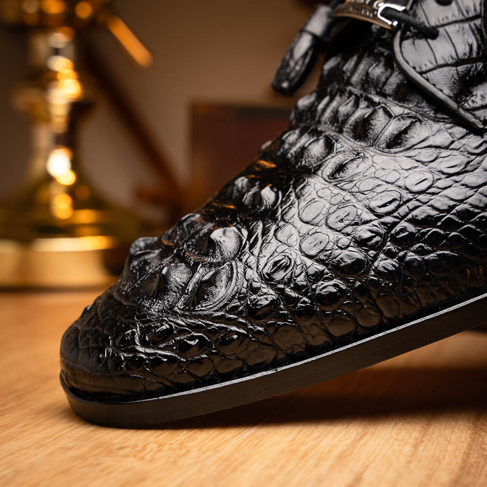 The Nilo Black by Marco Di Milano is a pair of luxury men's shoes made from polished black Nile crocodile skin with red inner lining and brown leather soles embossed with the brand name.