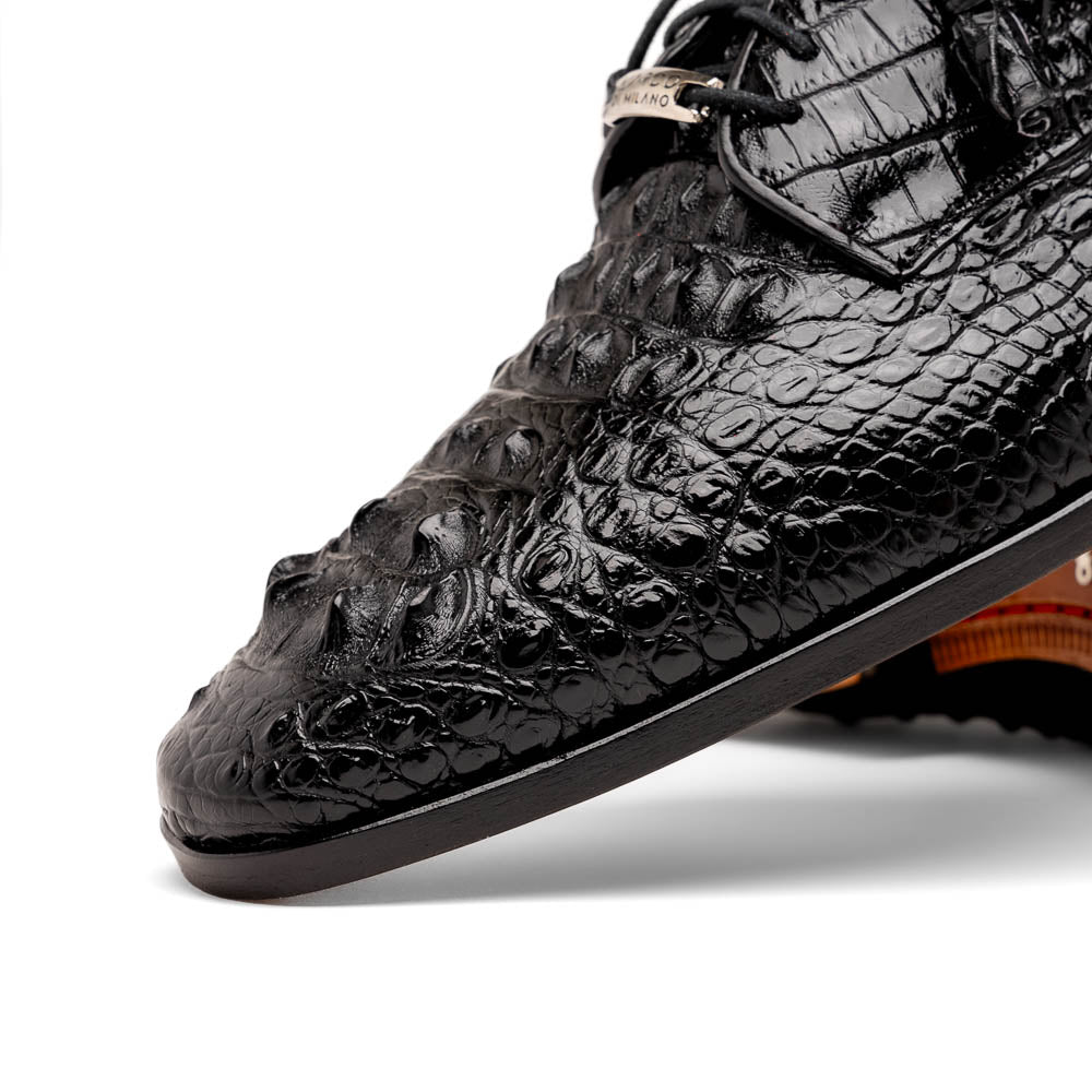 The Nilo Black by Marco Di Milano is a pair of luxury men's shoes made from polished black Nile crocodile skin with red inner lining and brown leather soles embossed with the brand name.