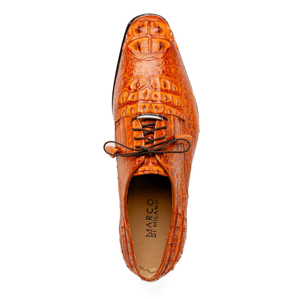 The Nilo Brandy by Marco Di Milano is a pair of orange luxury shoes made from Premium Nile Crocodile Skin with black laces—one shoe upright, the other flat to highlight its exquisite sole.