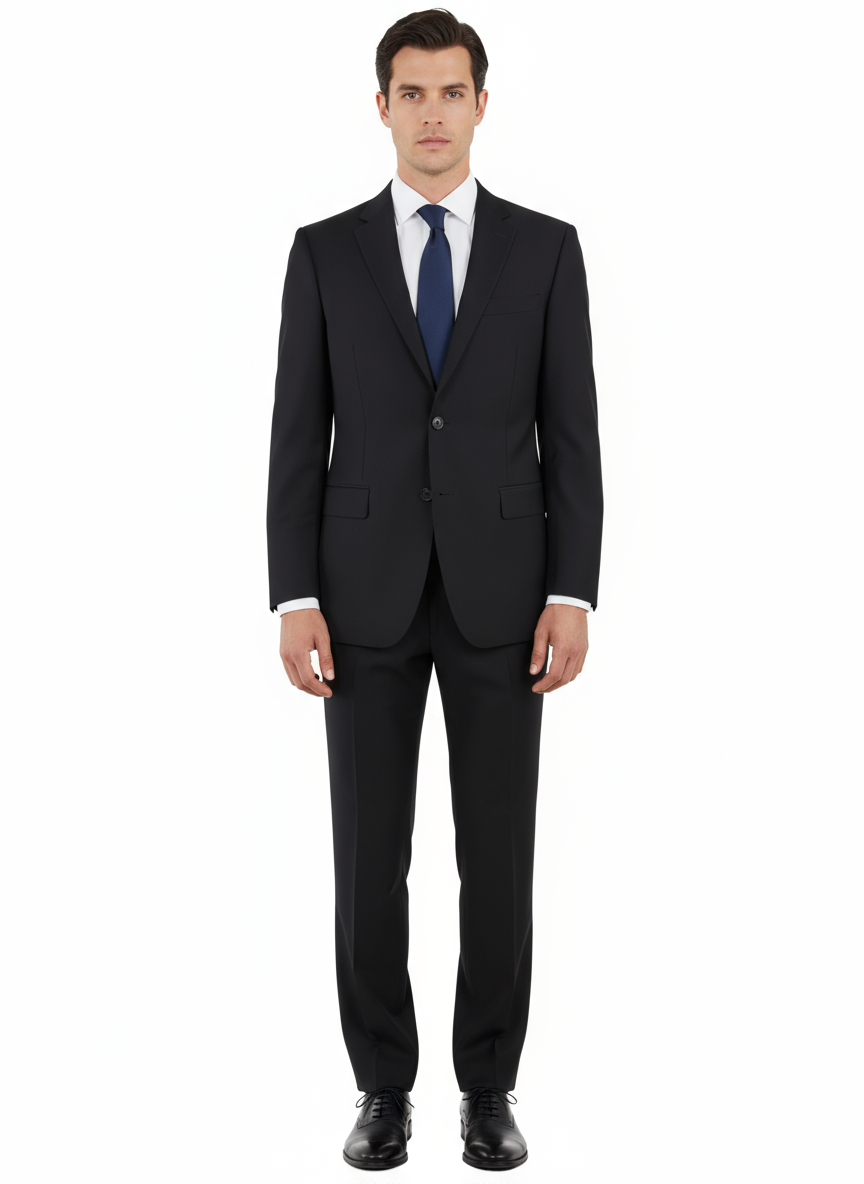 A man is seen standing facing forward against a plain white background, dressed in the Tiglio Luxe Novello Black Pure Wool Men’s Suit TIG1001 by Tiglio Luxe, paired with a white dress shirt and blue tie.