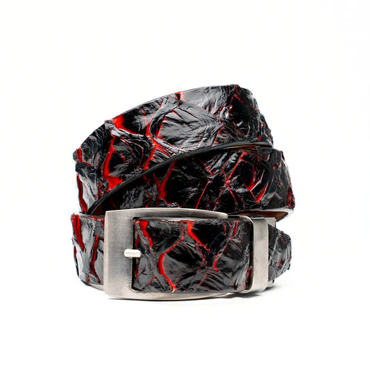 The Olivieri Belt Blackcherry by Marco Di Milano is a luxury men’s accessory crafted from black leather with red textured patterns, rolled up and showcased with a silver rectangular buckle on a white background—making it an exquisite exotic leather belt choice for any sophisticated wardrobe.