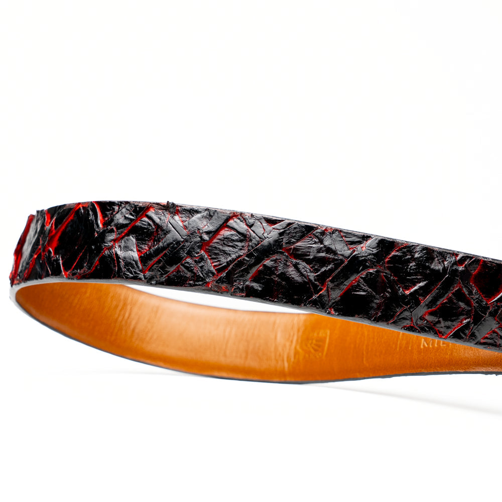 The Olivieri Belt Blackcherry by Marco Di Milano is a luxury men’s accessory crafted from black leather with red textured patterns, rolled up and showcased with a silver rectangular buckle on a white background—making it an exquisite exotic leather belt choice for any sophisticated wardrobe.