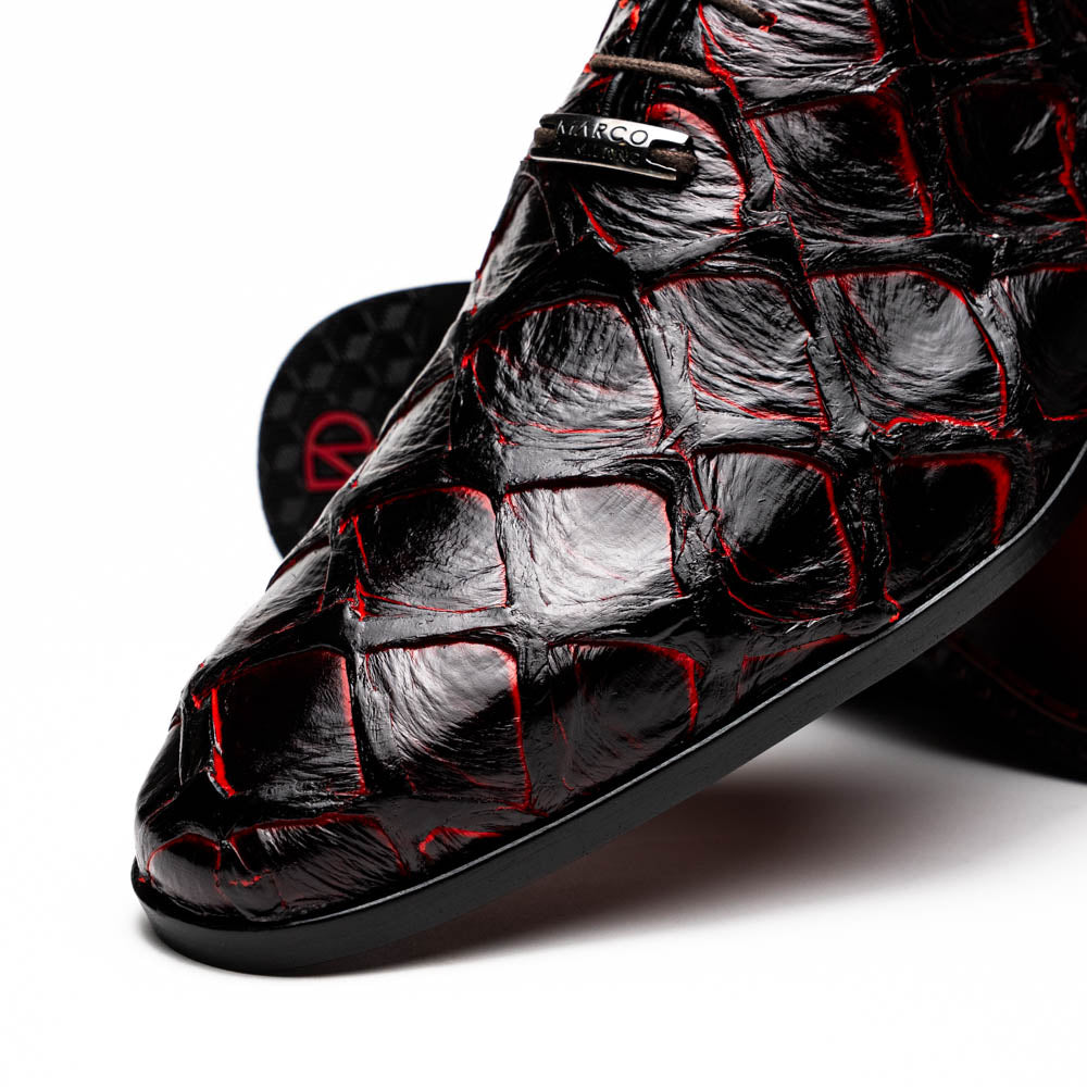 A pair of Marco Di Milano Olivieri Blackcherry oxfords—one upright, one on its side—displays the brand name on the sole, offering luxury men’s footwear with a strikingly exotic black and red pirarucu finish.